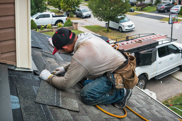Professional Emergency Roof Repair technician working in Marshfield, MA